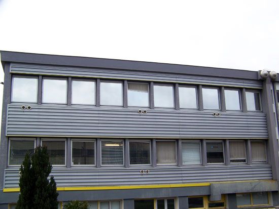Fenêtres bâtiment teintées et pose de film vitre teinté bâtiment de protection solaire